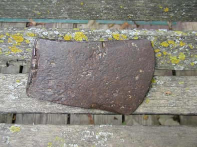 [ Axe Found at the Donnelly Homestead, Many objects have been unearthed at the site of the Donnelly homestead.  Some of the items may have belonged to the original Donnelly family.   Copyright Great Unsolved Canadian Mysteries Project, Jennifer Pettit,   ]