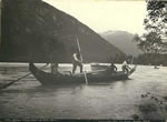 Indians poling canoe up Dyea River