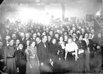 Men and women celebrating Christmas Eve in Pioneer Hall, Dawson