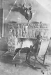 Annie Fraser, in front of Mowat Lodge fireplace